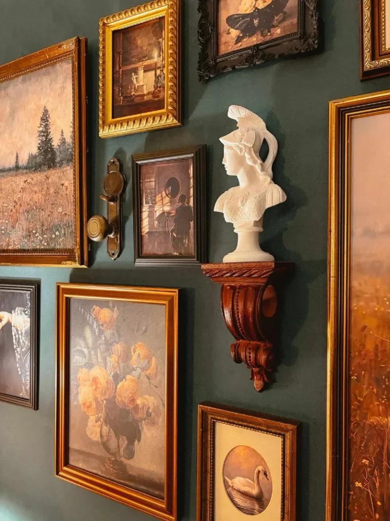 6. Deep Green Gallery Wall with Gold Frames and a White Classical Bust