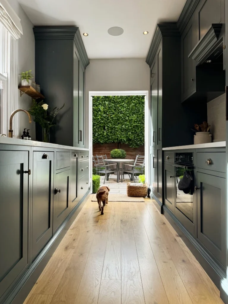 6. Deep Green Galley Kitchen with Open Garden Doors and Pale Oak Floors