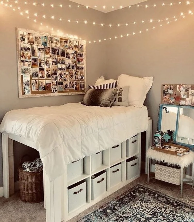 6. Dorm Style Raised Bed with White Cube Storage and Warm String Lights