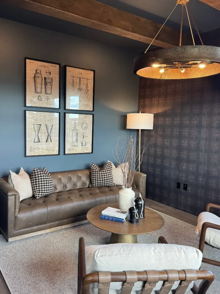 6. Taupe Leather Tufted Sofa with Patent Prints and a Black Drum Chandelier