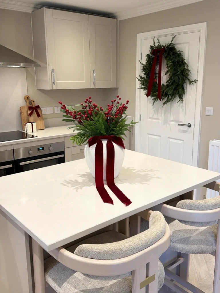 6. White Island Centerpiece with Red Velvet Ribbon and Door Wreath