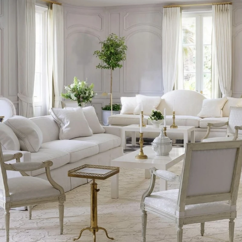 6. White Salon Living Room with Wall Molding and Gold Candlesticks