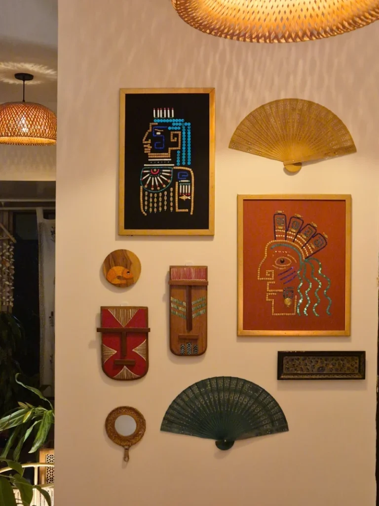 7. Afro-Inspired Mask Wall with Handcrafted Fans and Warm Ambient Lighting