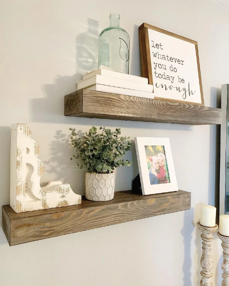 7. Rustic Wood Shelves with Glass Bottle, Family Photo, and Distressed Letter Decor