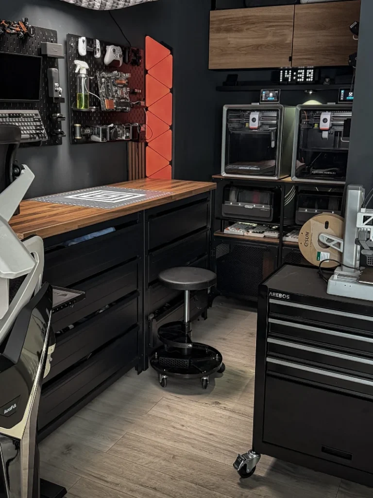 8. Black Maker Workshop with Wood Workbench, Pegboard Tool Wall, and 3D Printer Shelves