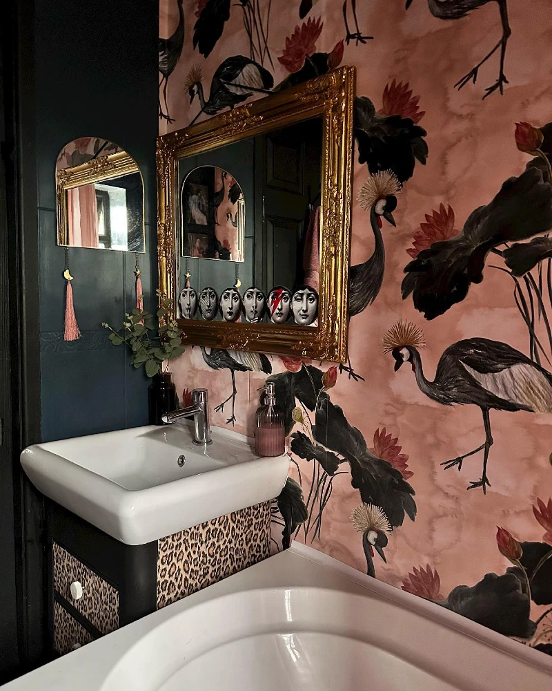 8. Ornate Gold Frame Mirror with Crane Wallpaper and Leopard Print Vanity Accent