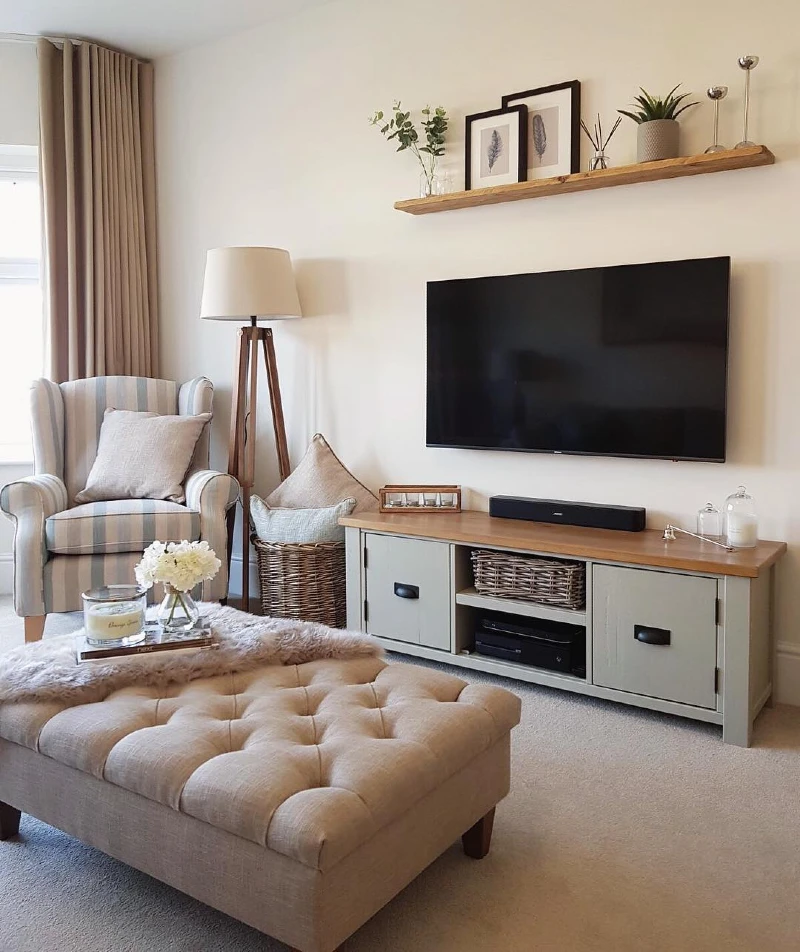 8. Slim TV Shelf with Botanical Prints, Glass Stems, and Soft Greenery