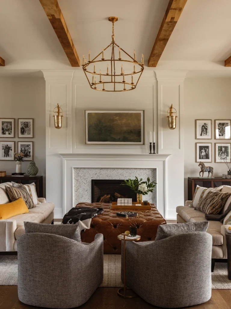 8. Tufted Leather Ottoman with White Fireplace, Wood Beams, and Family Photo Walls