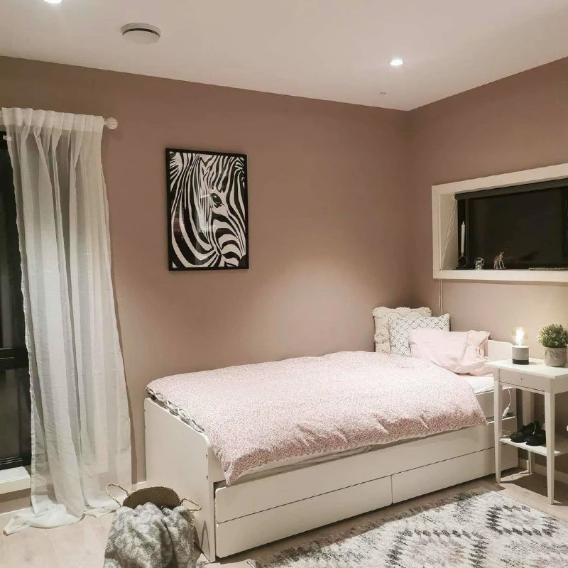 8. White Daybed with Flush Under Bed Drawers and Soft Pink Bedding