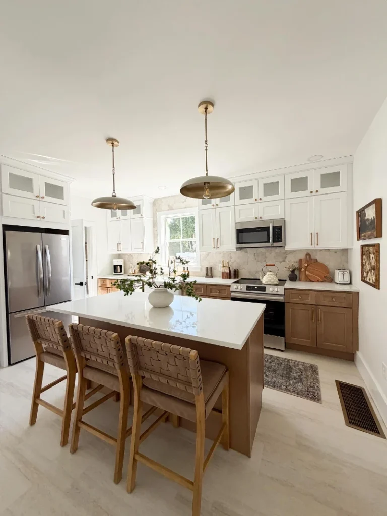 8. White Shaker Cabinets with Warm Wood Island and Woven Counter Stools