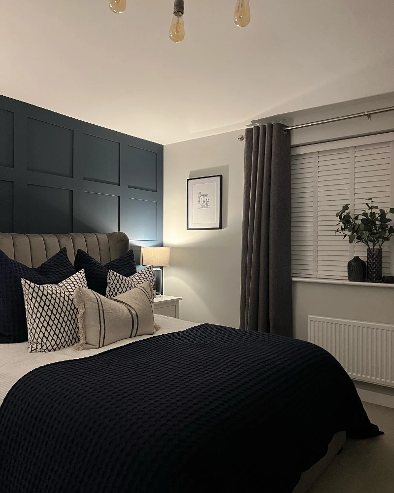 9. Navy Panel Wall with Taupe Channel Headboard and Textured Black Bedding