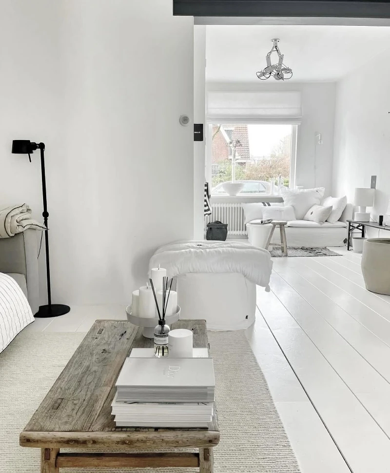 9. White Sectional with Photo Gallery Wall and Black Metal Table Legs