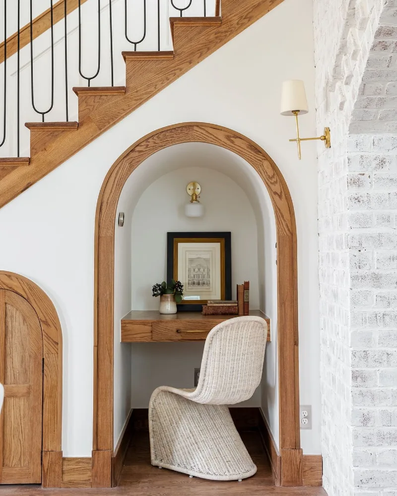 Arched Oak-Trimmed Office Nook with Woven Wicker Chair and Floating Desk