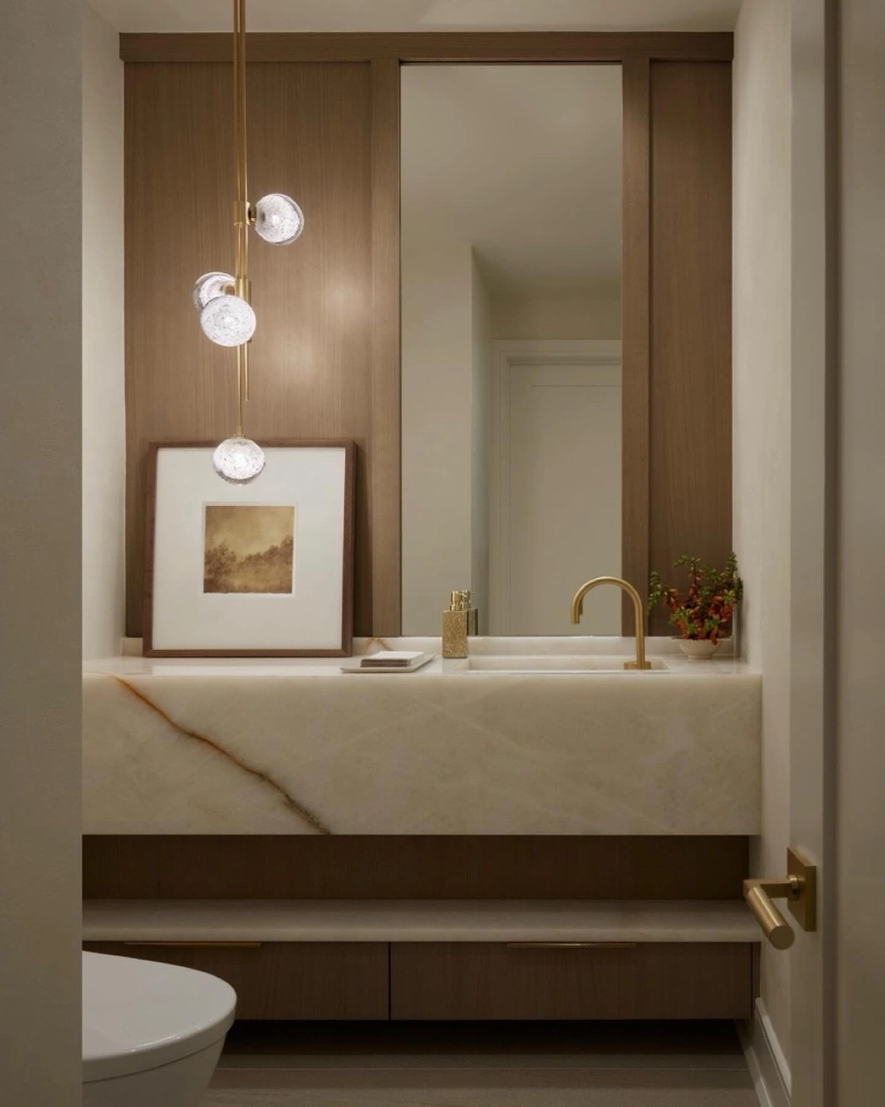 Backlit Onyx Block Vanity with Slender Vertical Mirror and Asymmetric Glass Pendant