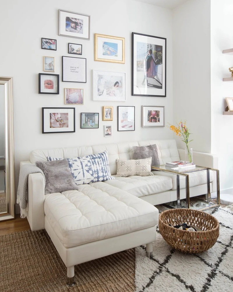 Black Frame Grid Above Sofa with Mixed Photo Gallery