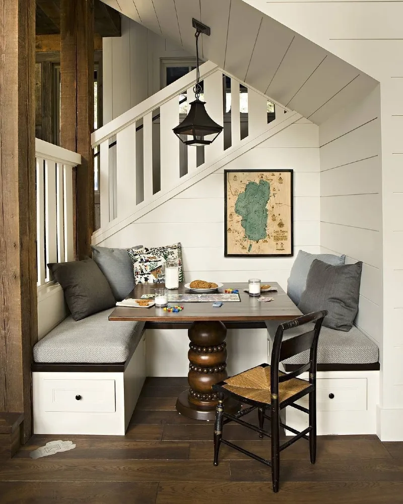 Built-In Dining Banquette with Pedestal Table and Shiplap Walls