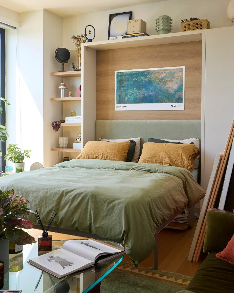 Built In Headboard Wall with Monet Art and Sage Green Bedding Storage Nook
