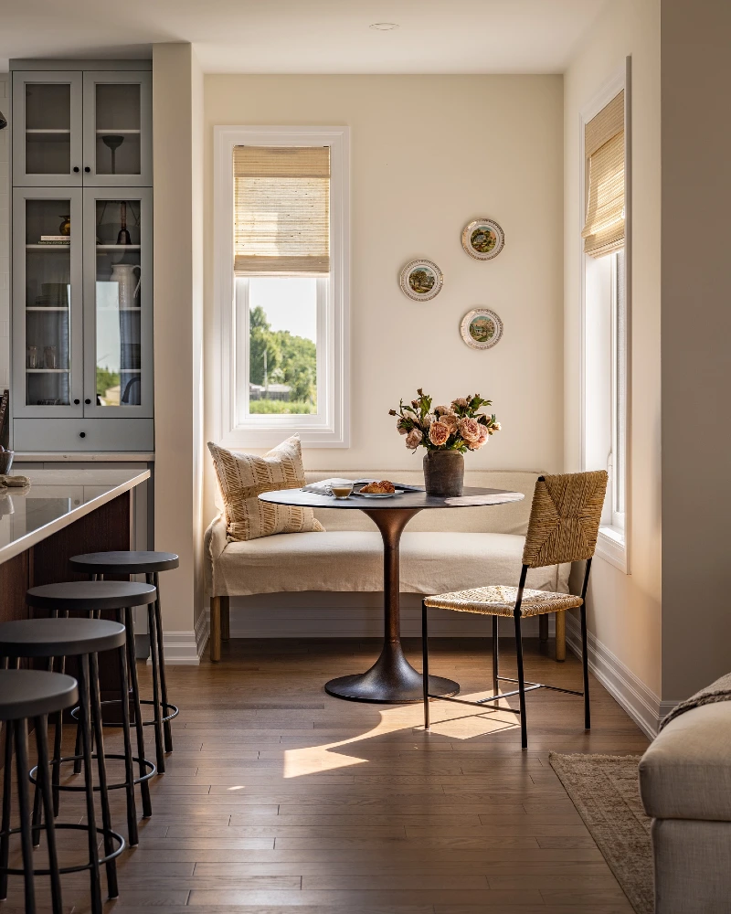 Built-In Window Bench with Round Pedestal Table and Black CafΓ© Chairs