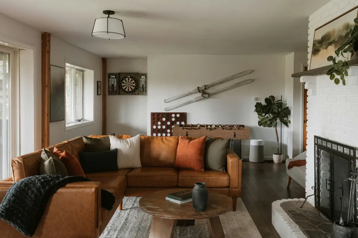 Caramel Leather Sectional with Vintage Skis and Game Room Touches