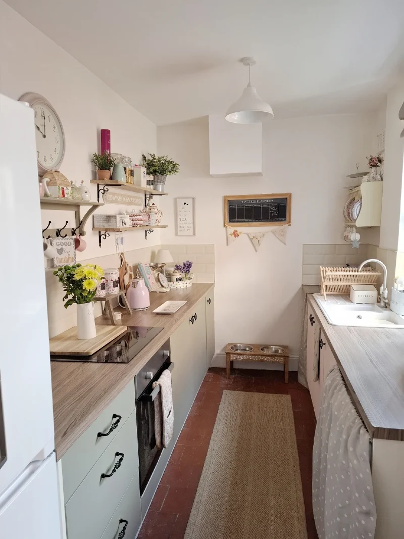 Cottage Shelf Tiers with Small Glass Jars, Potted Herbage, and a Traditional Kitchen Clock