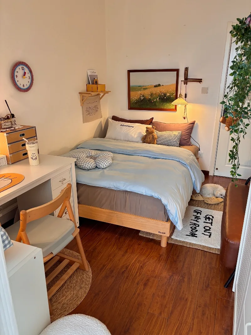 Cozy Blue Bedding Bedroom with Desk Corner and Soft Wall Art Glow