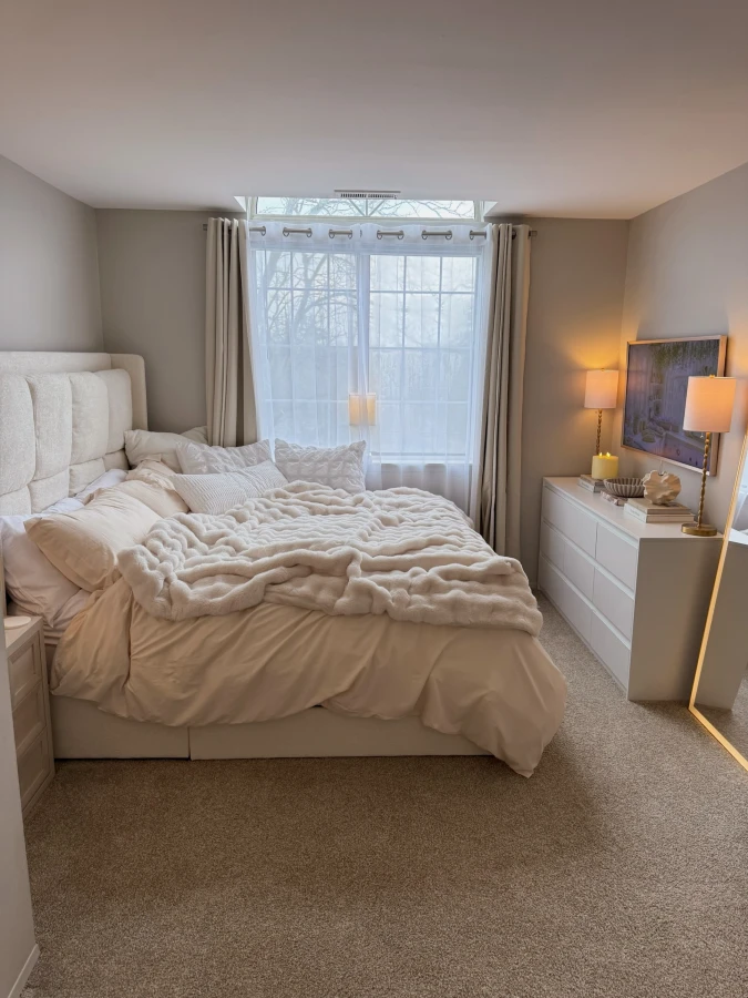 Cream Channel Headboard with Chunky White Throw and Warm Dresser Lamps