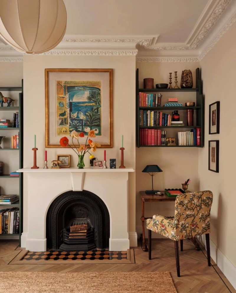 Cream Fireplace Wall with Dark Green Shelves and Floral Desk Chair