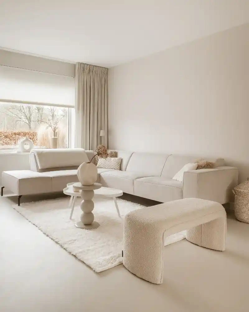 Cream Sectional with Bouclé Bench and Sculptural Pedestal Table