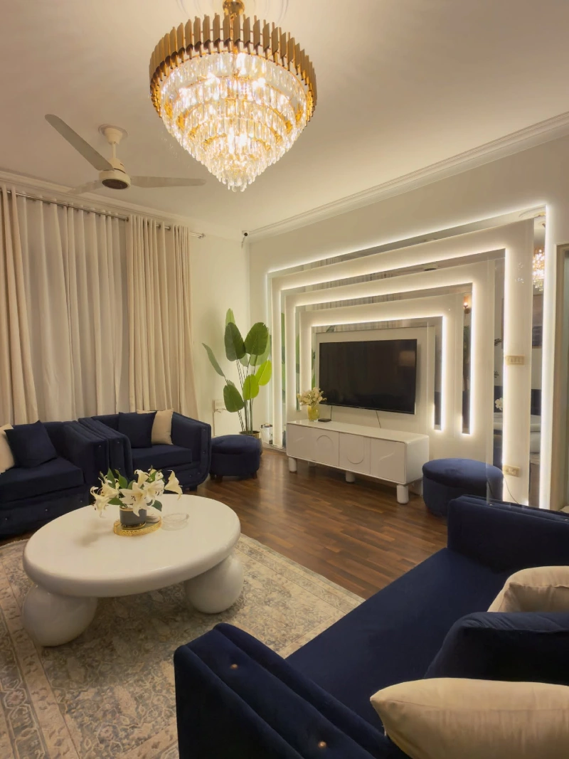 Crystal Chandelier Statement with Deep Navy Lounge Contrast