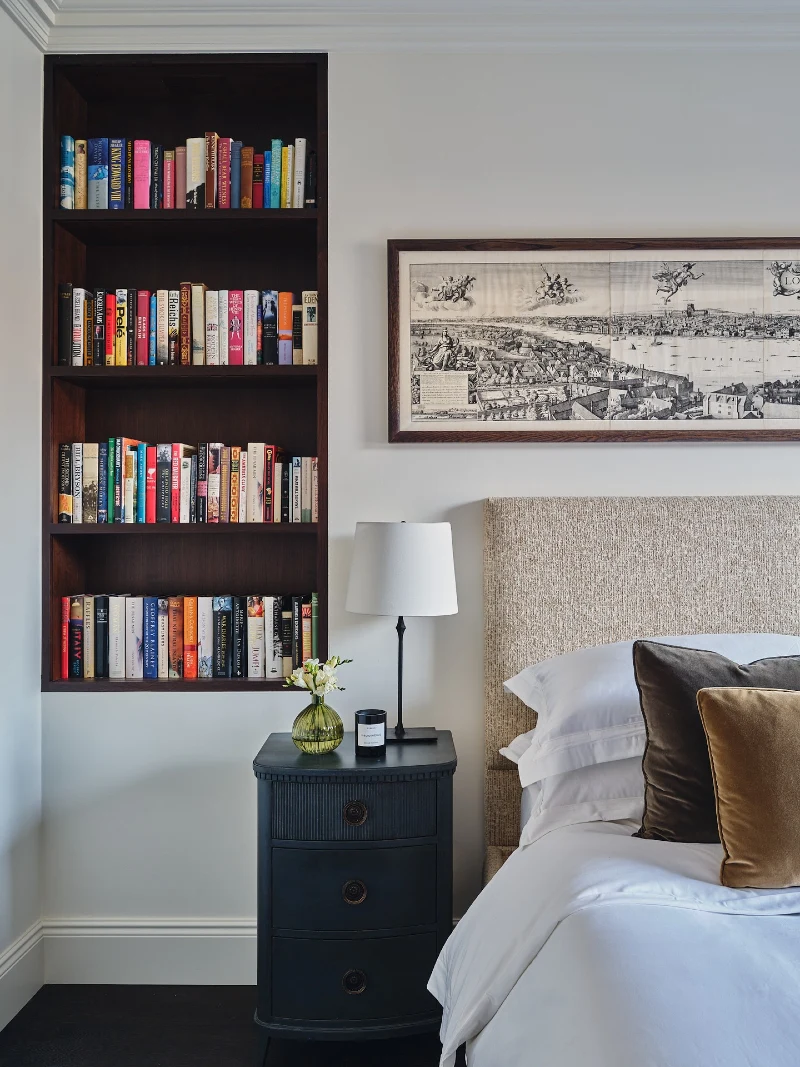 Dark Wood Bedroom Book Niche with City Print and Velvet Pillows
