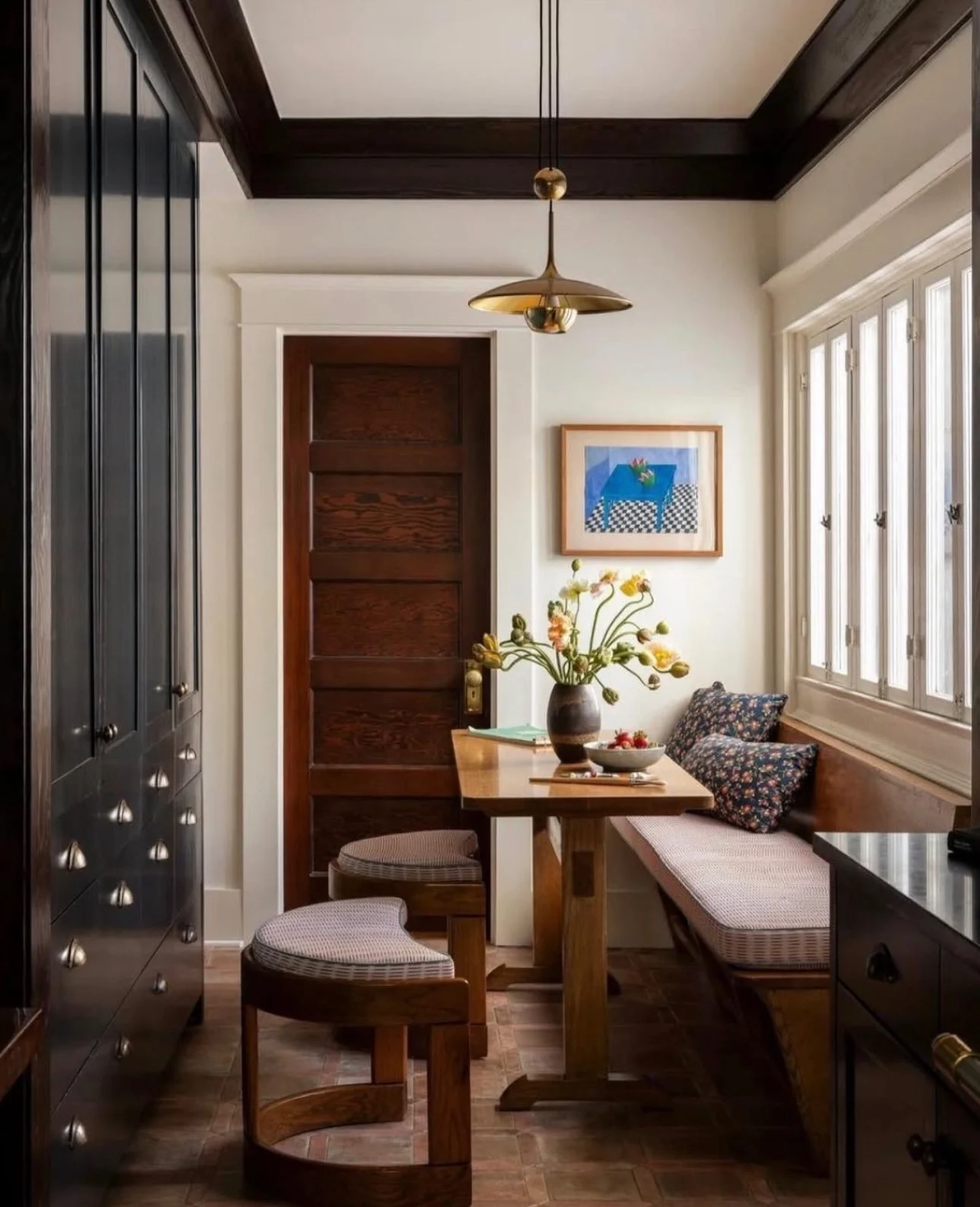 Dark Wood Breakfast Nook with Floral Cushions