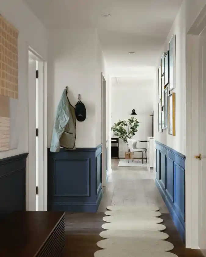 Deep Blue Wainscoting with Minimalist Wall Hooks
