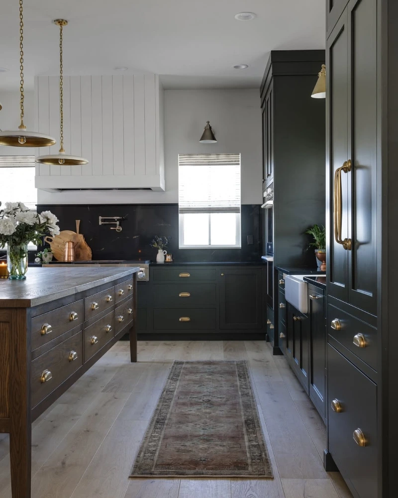 Deep Forest Green Cabinets With Dark Marble Backsplash and White Shiplap Hood