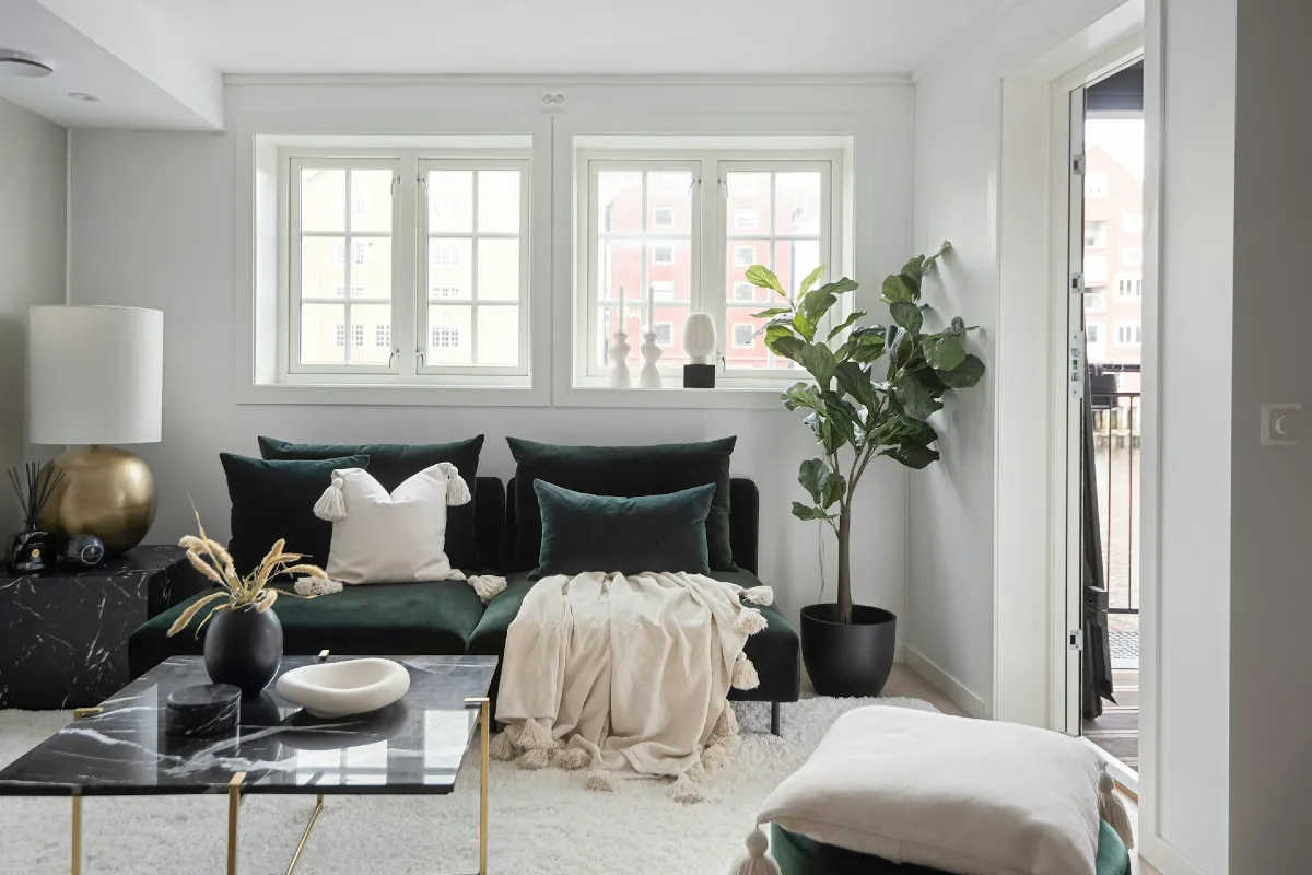 Deep Green Velvet Sofa with Black Marble Coffee Table