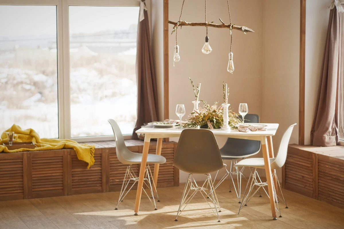 Driftwood Pendant Light Above a Minimal Dining Table