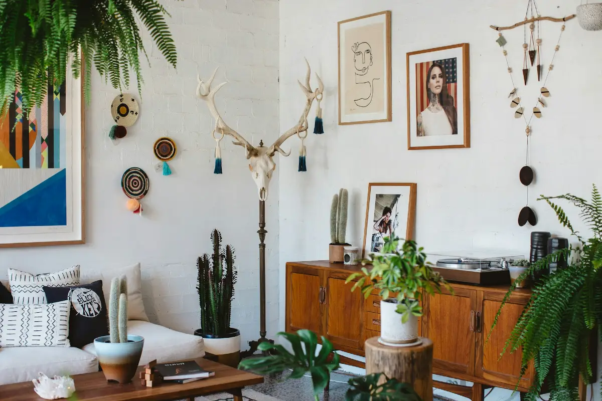 Eclectic Art Wall with Mid Century Wood Credenza and Indoor Greenery