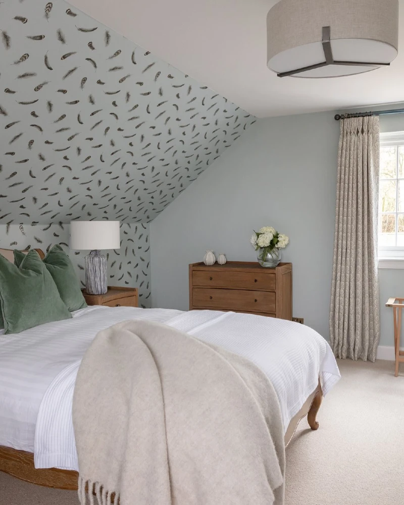 Feathered Wallpaper Accent Incline with Sage Pillows and Oak Dresser