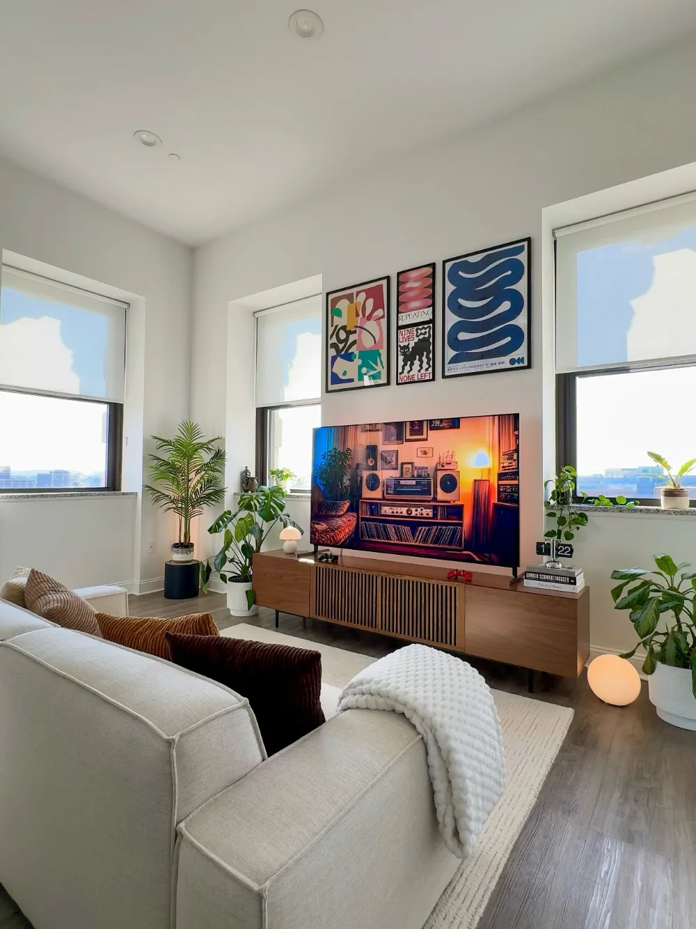 Floating Media Console Wall with Color Pop Art and Plant Framed Windows