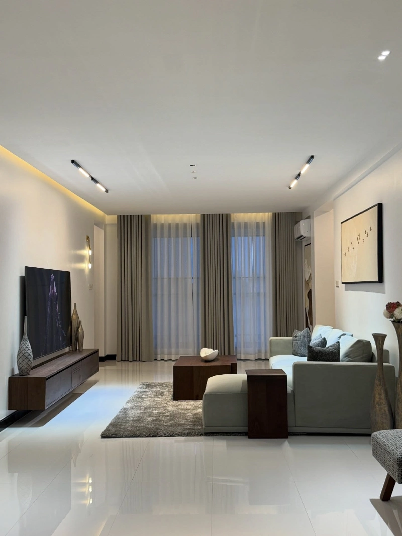 Floating Media Wall with Warm Cove Lighting and Clean Modern Lines