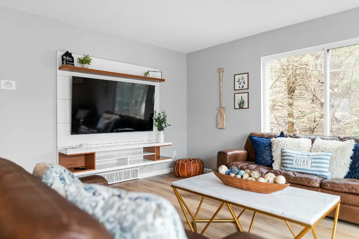 Floating TV Console with Warm Wood Shelf Styling