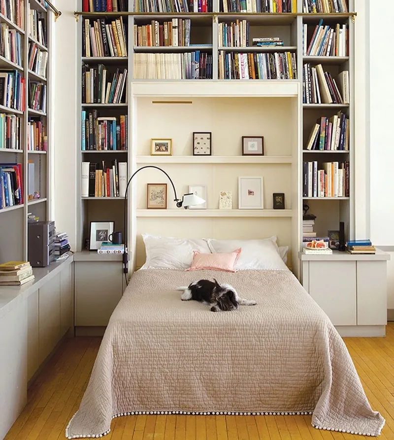 Floor-to-Ceiling Library Bookcases with Recessed Picture Ledges and Pom-Pom Trim Coverlet