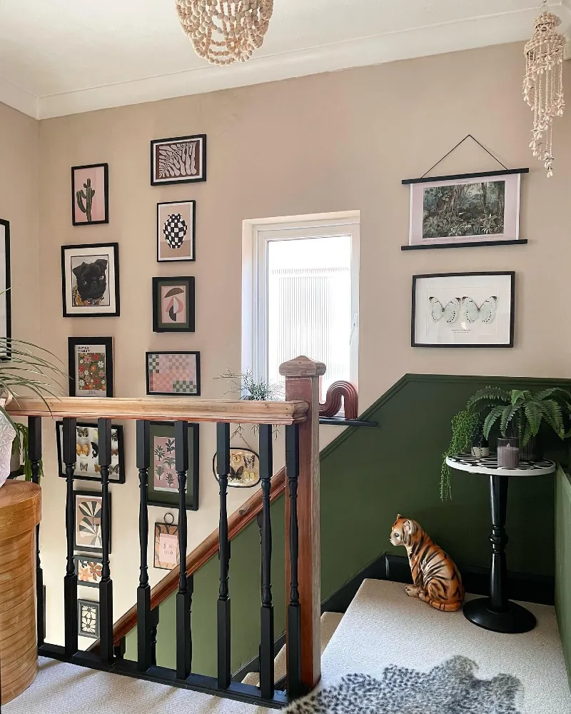 Forest Green Accent Wall with Eclectic Artwork, Beaded Chandeliers, and a Ceramic Tiger