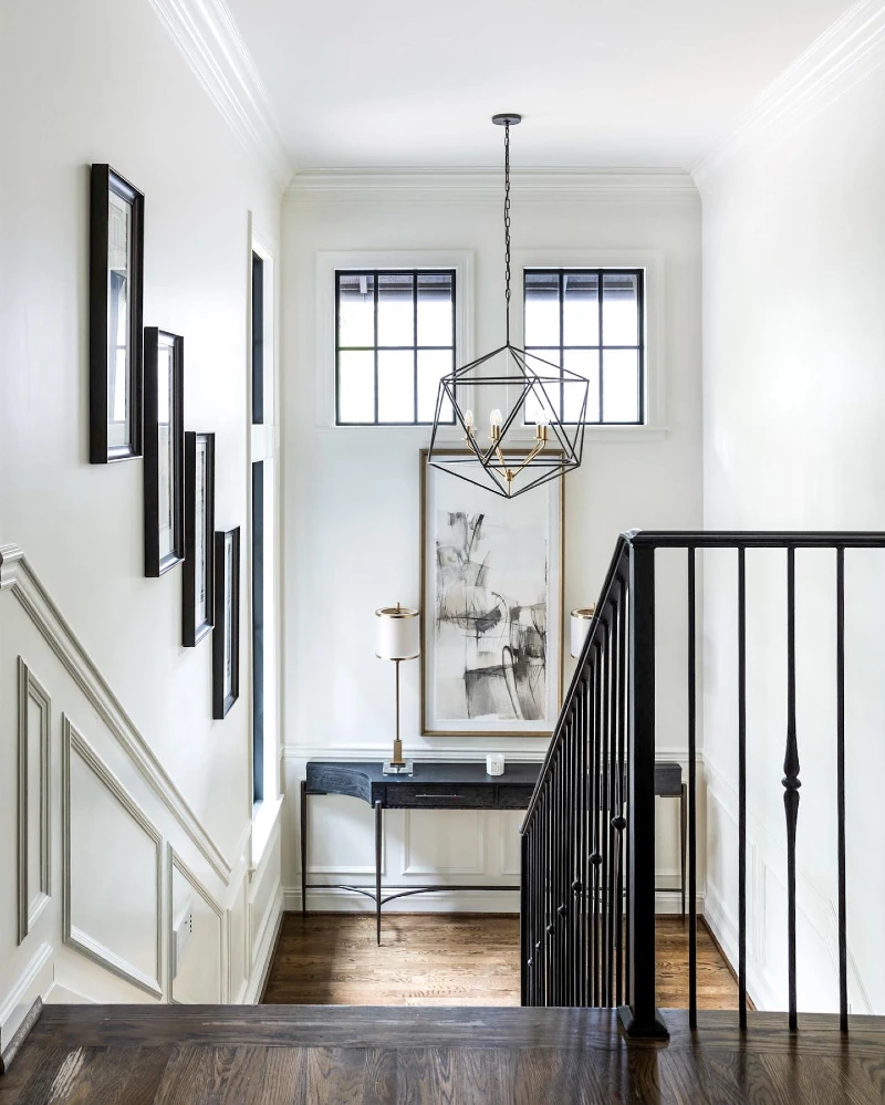 Geometric Iron Chandelier with Abstract Canvas Art and a Curved Console Table