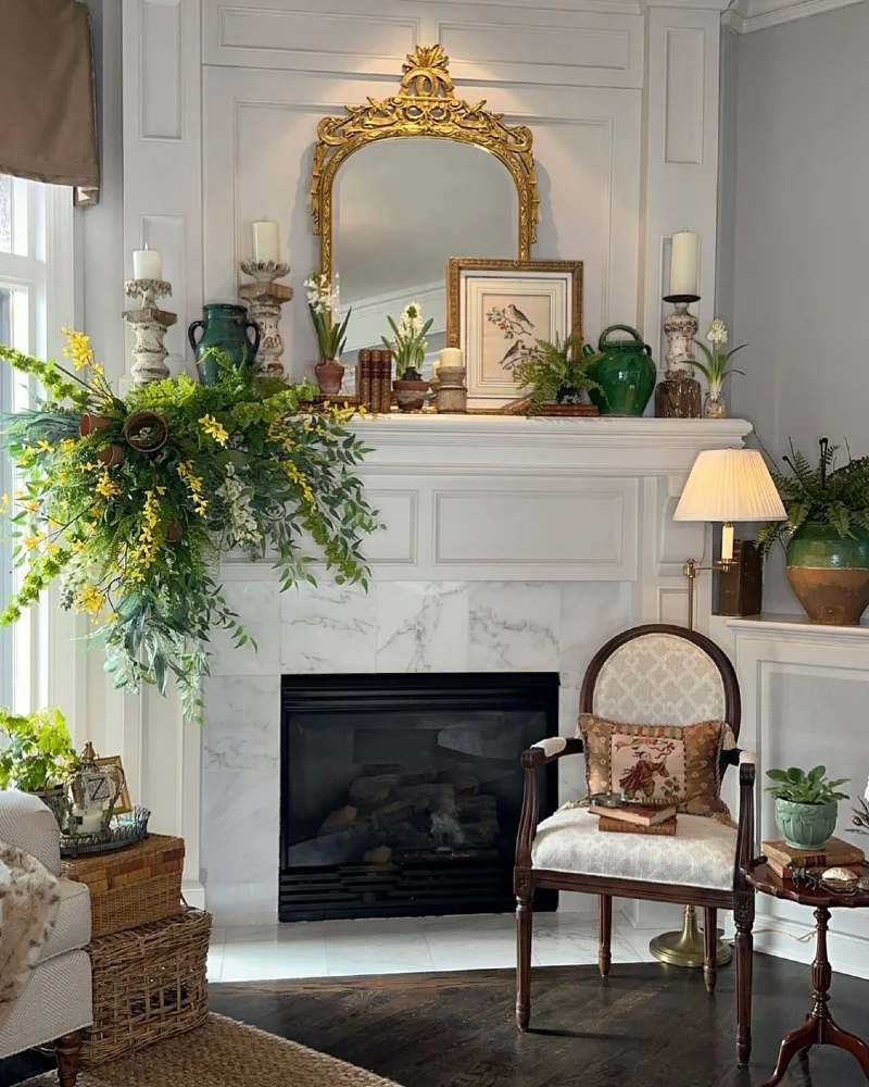 Gilded Mirror Mantel with Green Urns, Candleholders, and Cascading Spring Branches