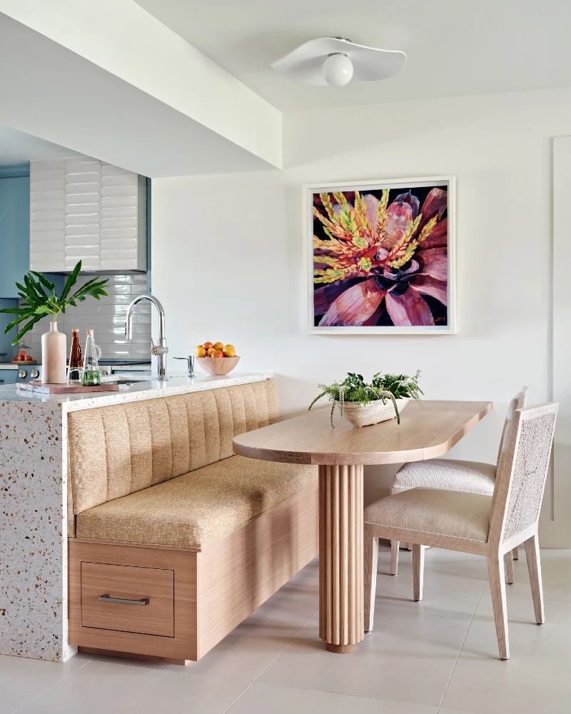 Golden Banquette with Fluted Wood Table and Terrazzo Kitchen Edge