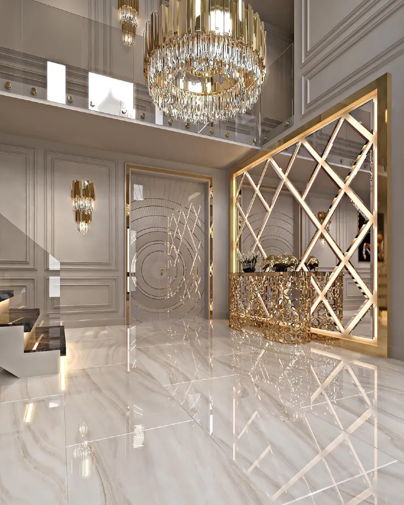 Grand Marble Foyer with Tiered Crystal Chandelier and Geometric Gold Accent Wall