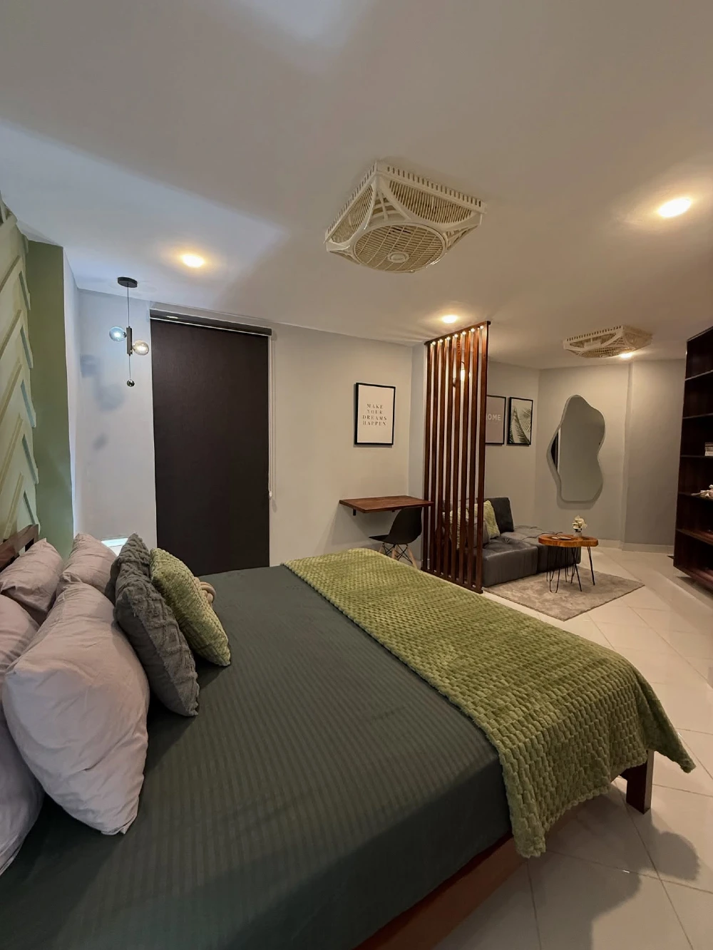 Green Layered Bed with Wooden Slat Divider and Minimal Studio Lounge Layout