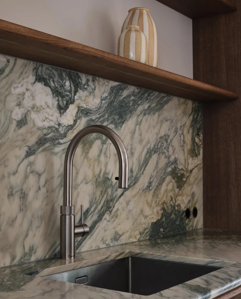 Green Marble Stone Backsplash with Walnut Shelf and Stainless Steel Faucet Detail