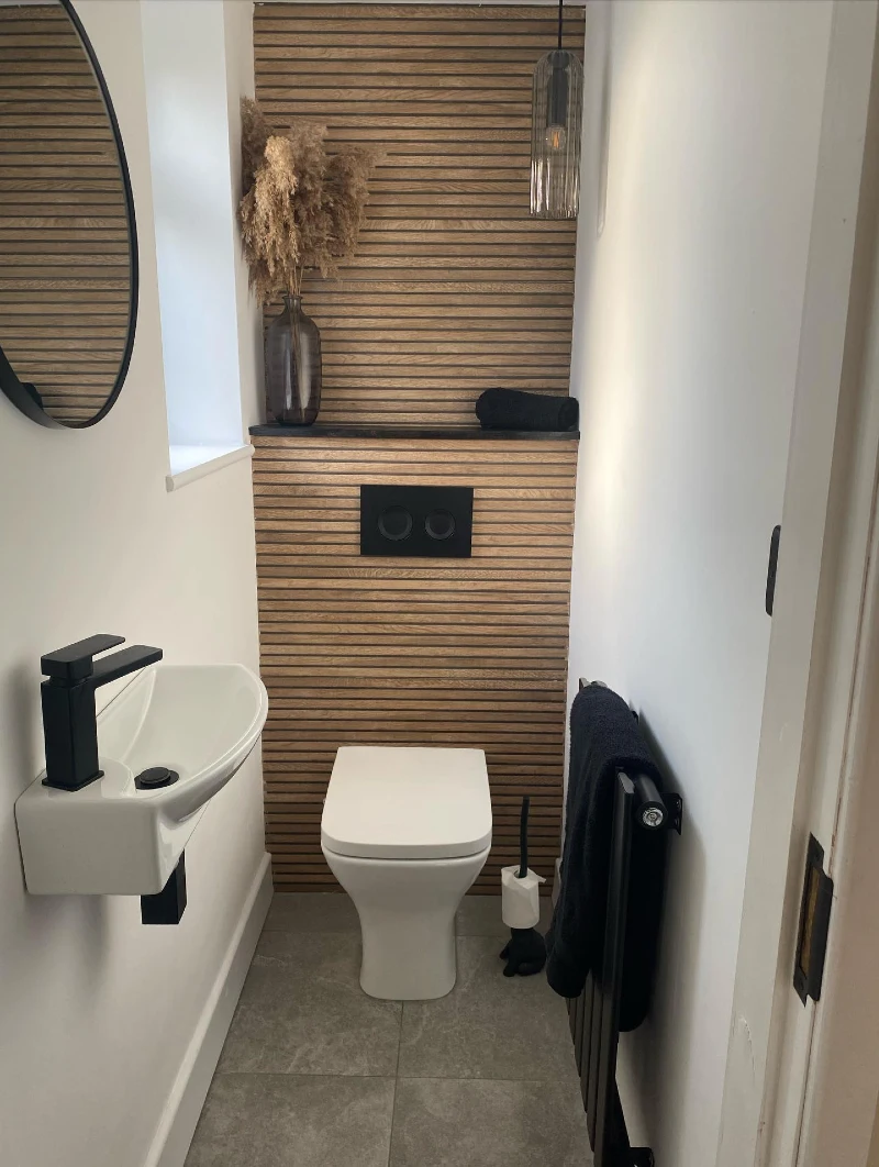 Horizontal Wood Slat Accent Wall with Matte Black Flush Plate and Slim Corner Basin
