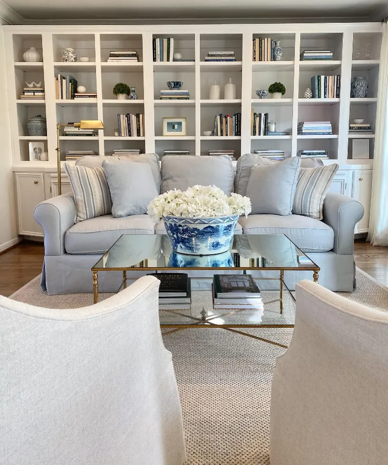 Light Blue Living Room with White Built In Shelves and Blue China Bowl